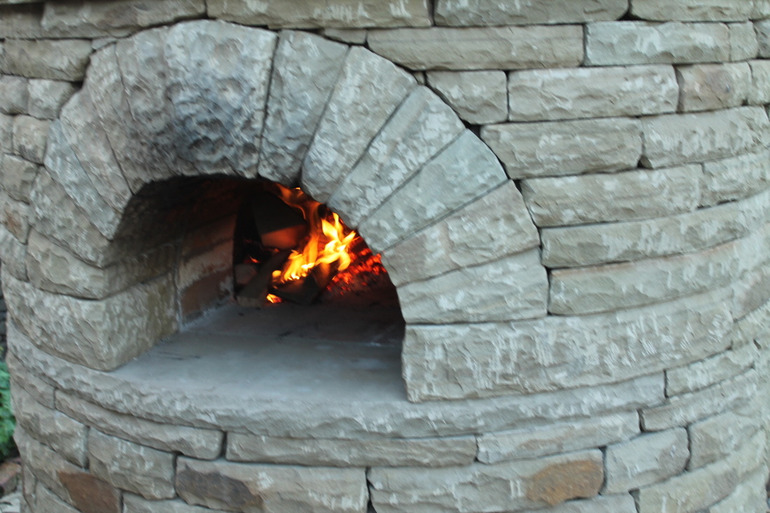 lighting the wood fired pizza oven for the first time and 'prooving' it